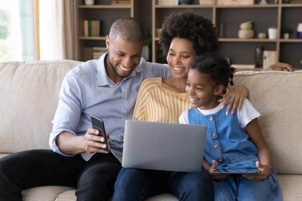 Happy africa family using fiber optic to watch movie